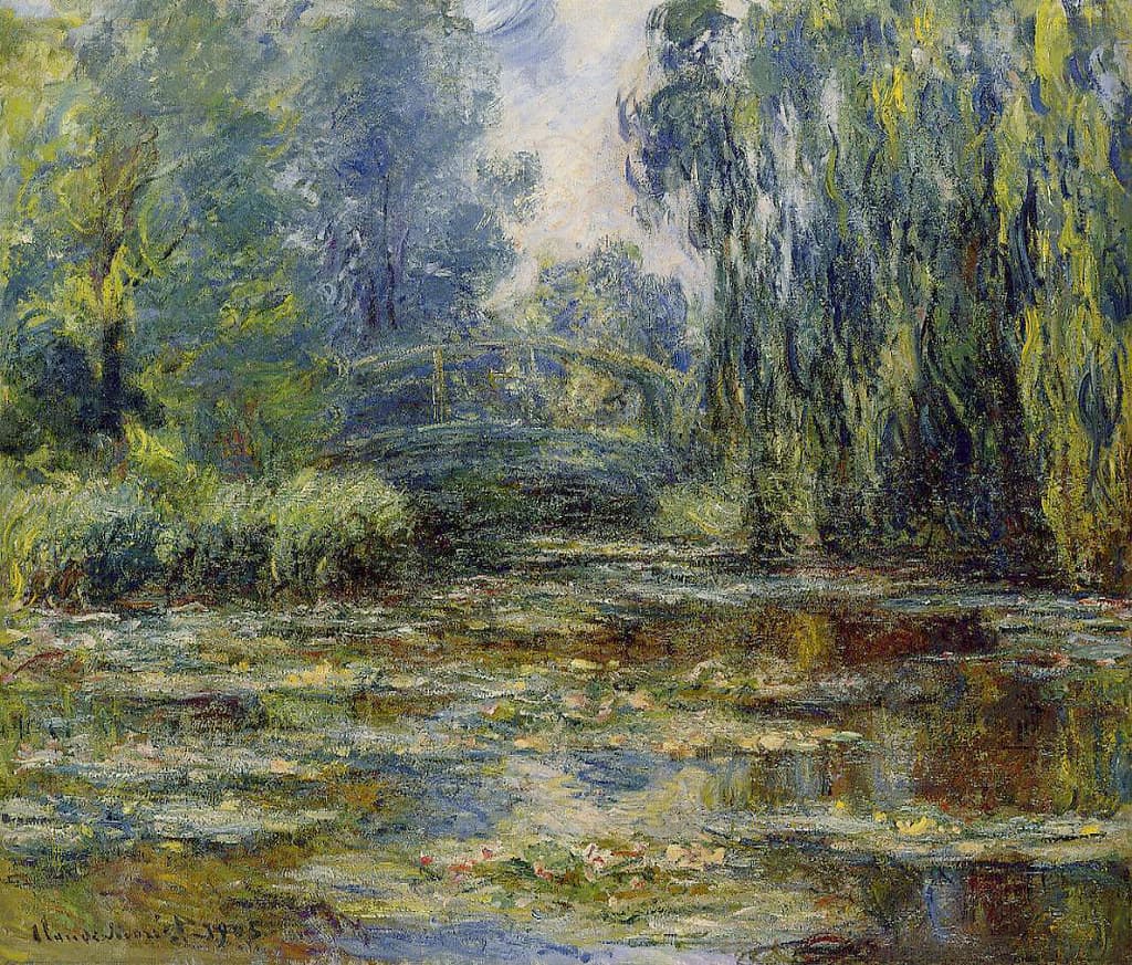 A shadowed footbridge spans a lily-covered pond beneath trees and a weeping willow, light breaking through the leaves — Claude Monet, The Water-Lily Pond and Bridge, 1905