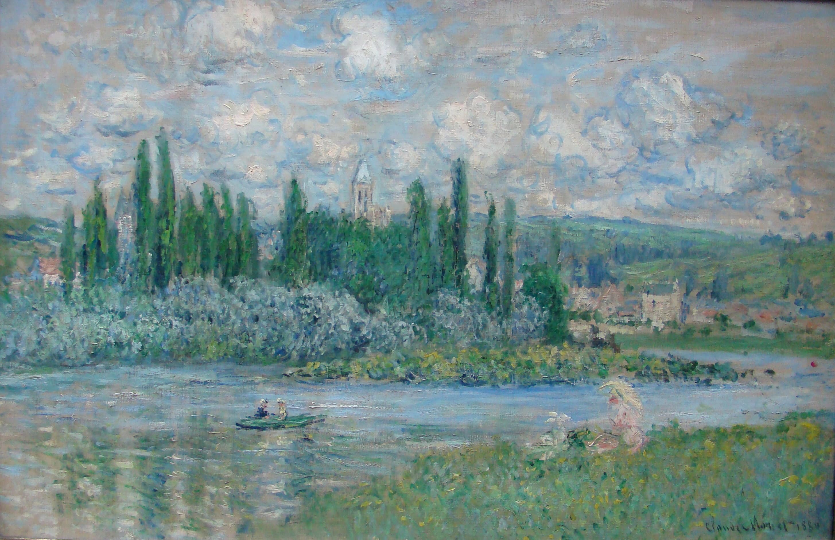 A village with a church tower among tall poplars lies across a calm river under white summer clouds, a rowing boat on the water and a woman with a parasol on the bank — Claude Monet, View of Vétheuil, 1880