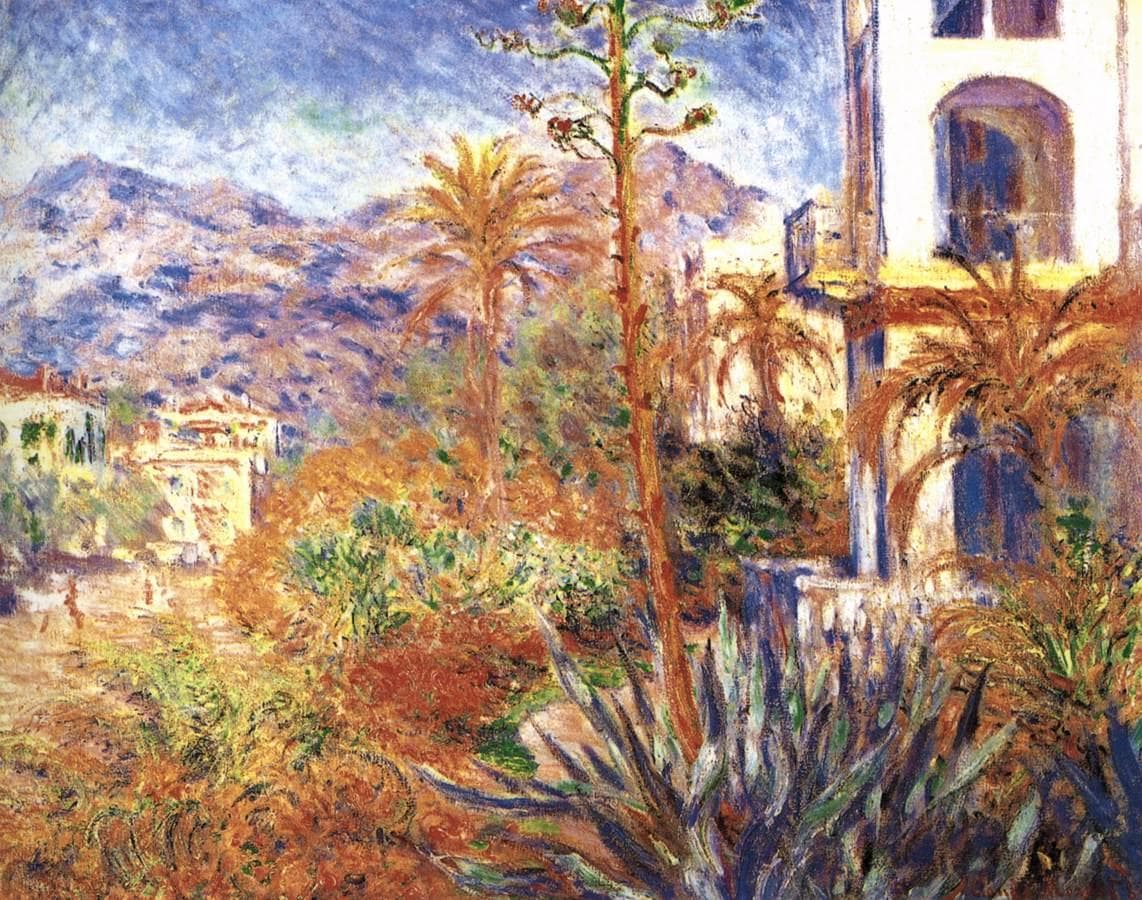 A tall agave flower stalk rises among palms and orange foliage beside a white villa, with blue mountains behind — Claude Monet, Villas in Bordighera, 1884