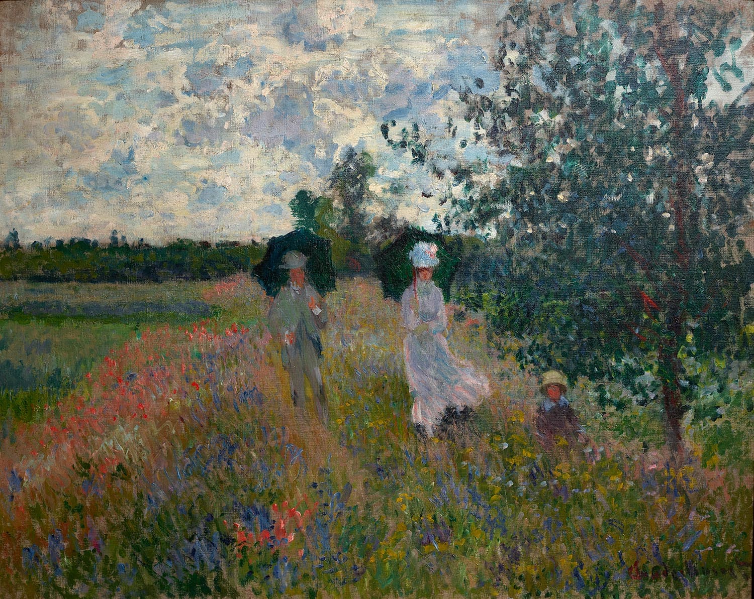A woman in white and a man under dark parasols walk through a meadow of red poppies and blue flowers, a child in the grass and a tree at right — Claude Monet, Walk near Argenteuil, 1875