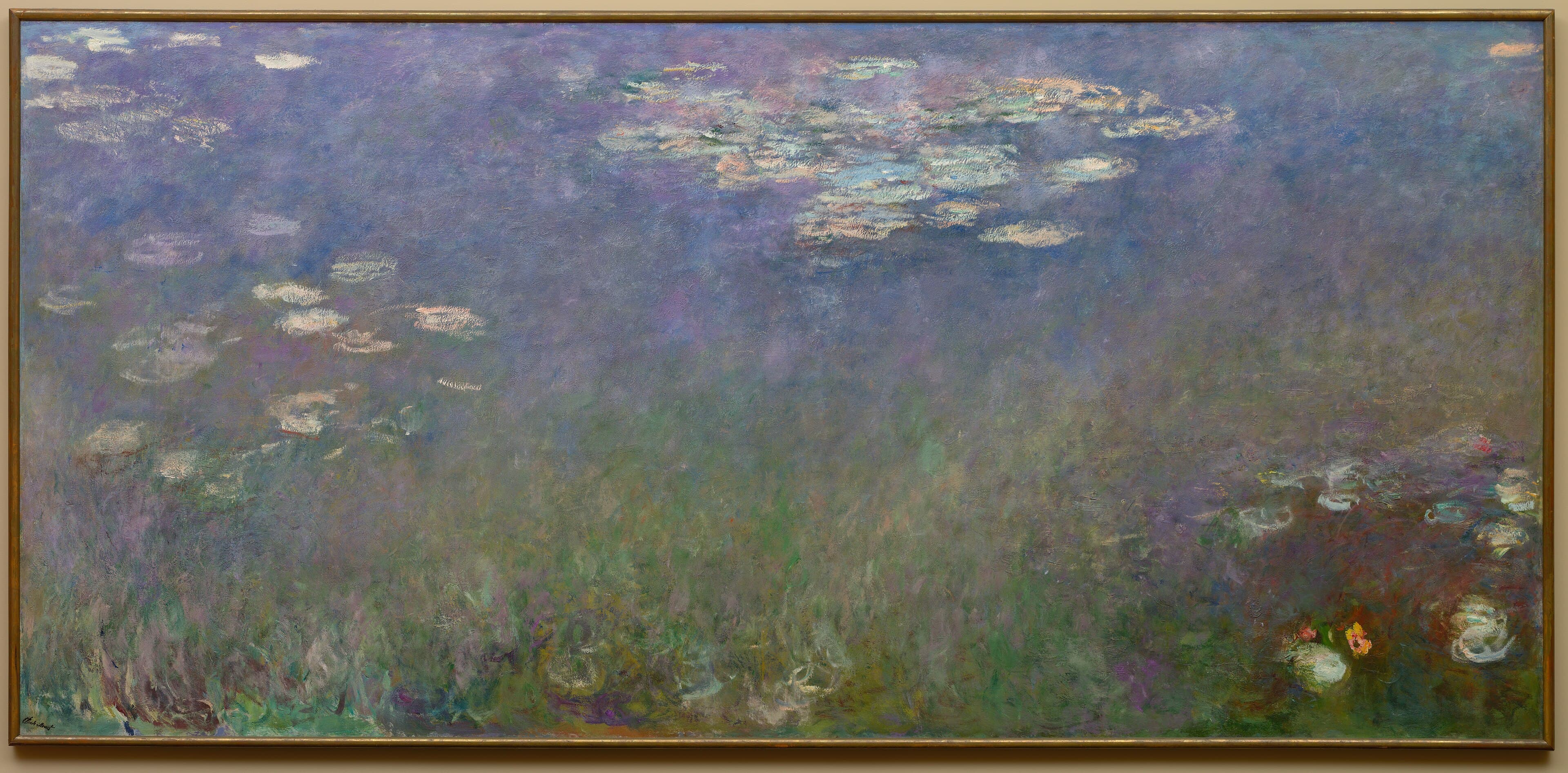 A very wide canvas of violet and blue water with drifting pale lily pads, dark green reflections along the bottom and a few white and orange flowers at right — Claude Monet, Water Lilies (Agapanthus), c. 1915–26
