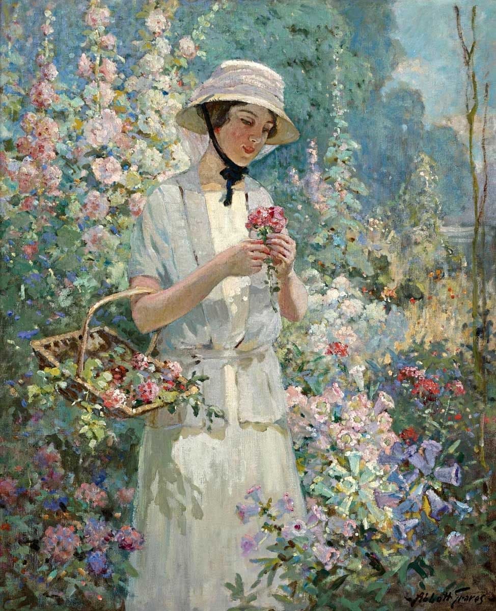 A young woman in a white dress and straw hat holds pink roses, a wicker basket of flowers on her arm, among tall hollyhocks — Abbott Fuller Graves, Woman with Flower Basket